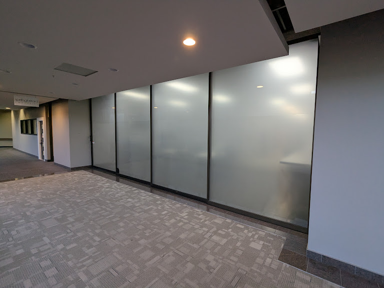Frosted interior office partitions with black frames