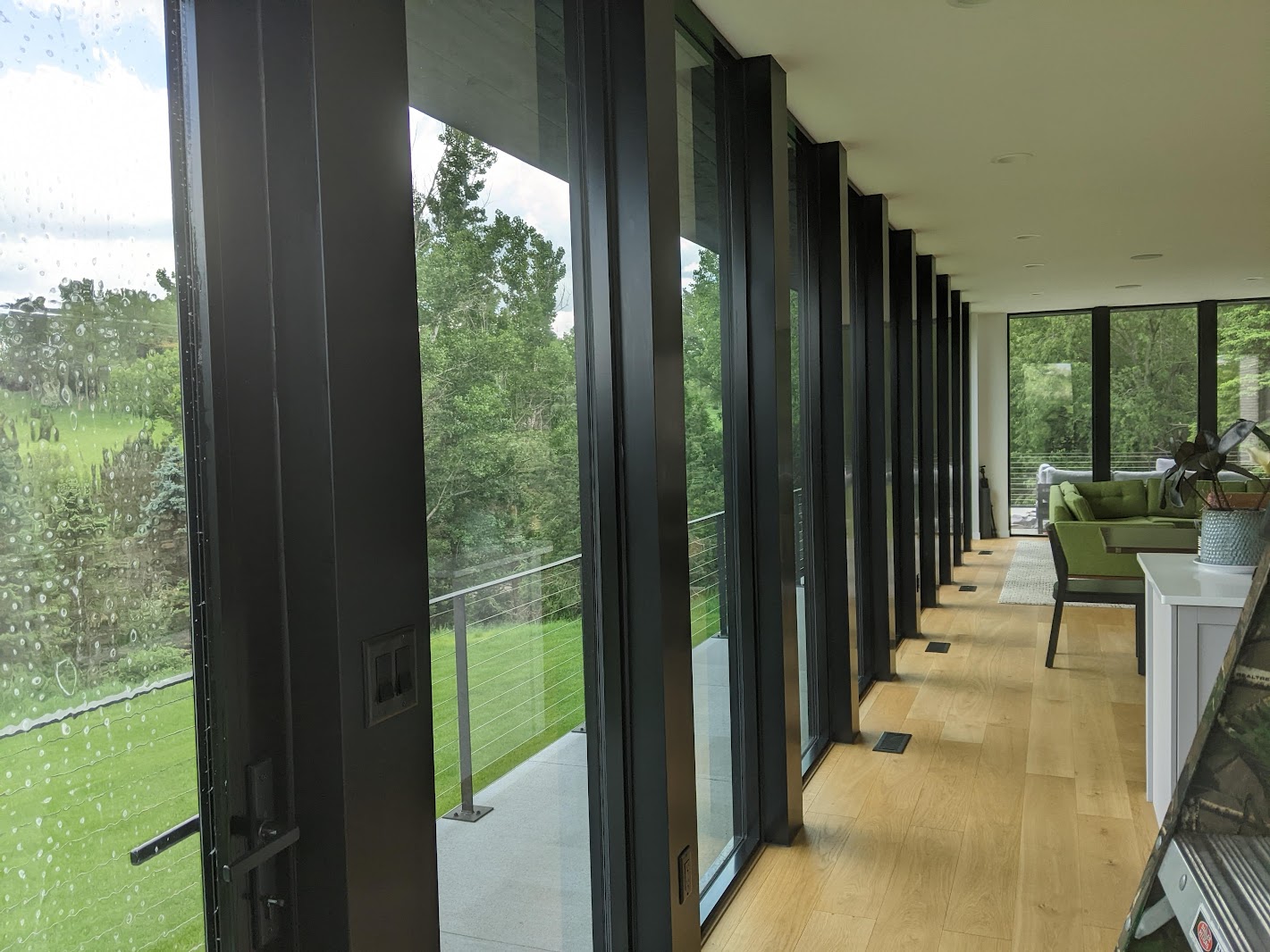 Long hallway of floor-to-ceiling windows in a Sioux City home