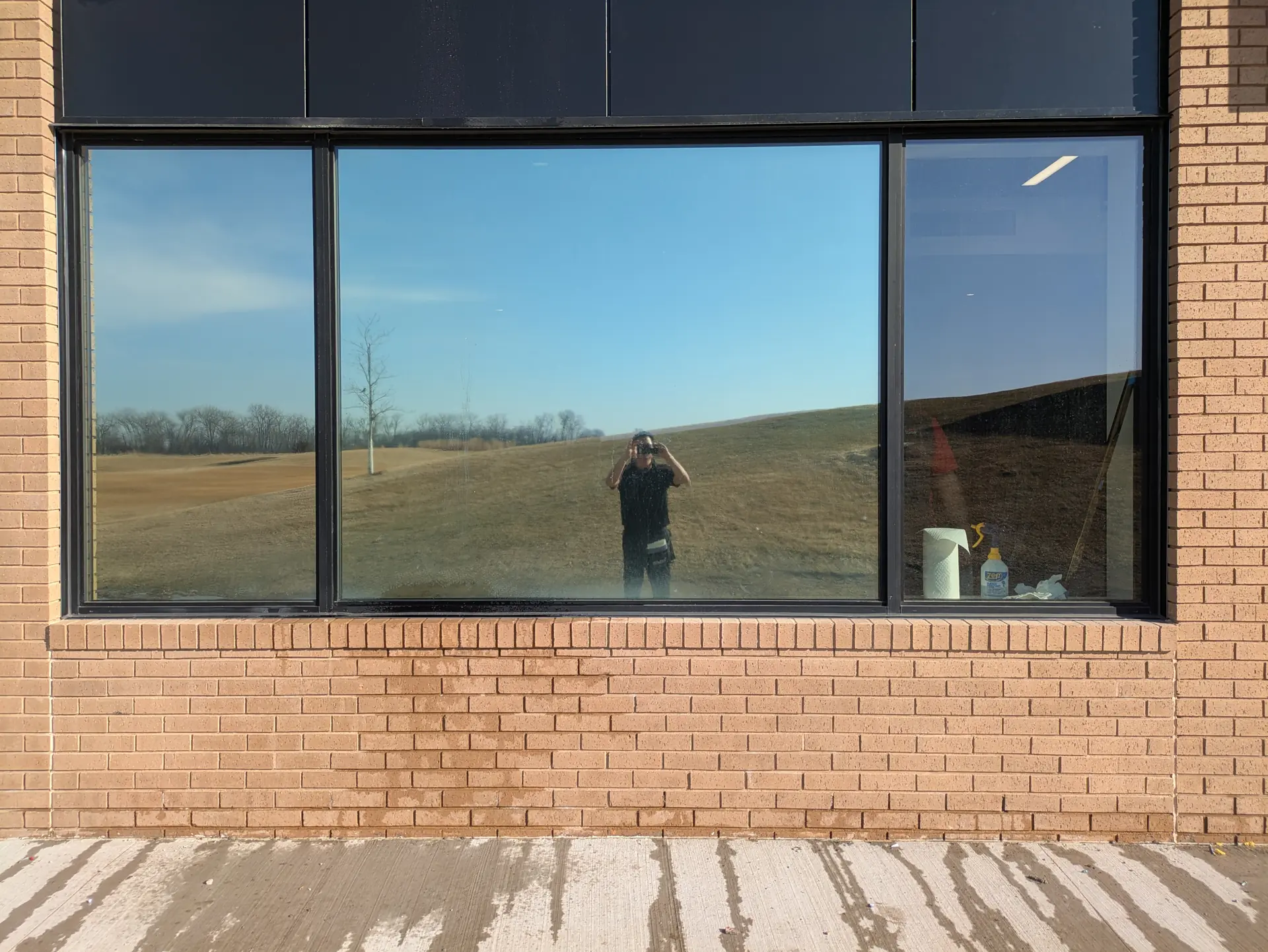 Indoor golf simulator windows with DR05 light control film in Dakota Dunes (exterior)