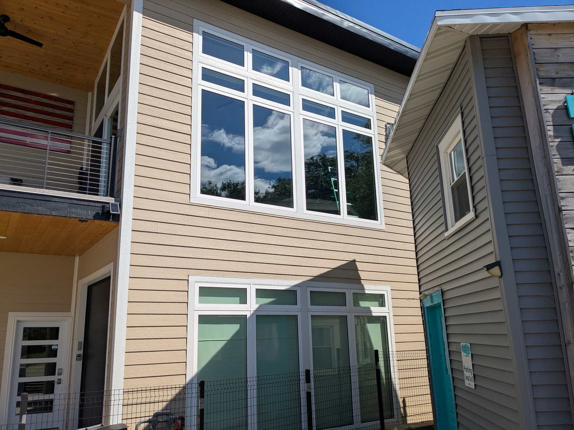 Lake home exterior with tall windows in Arnolds Park, Iowa