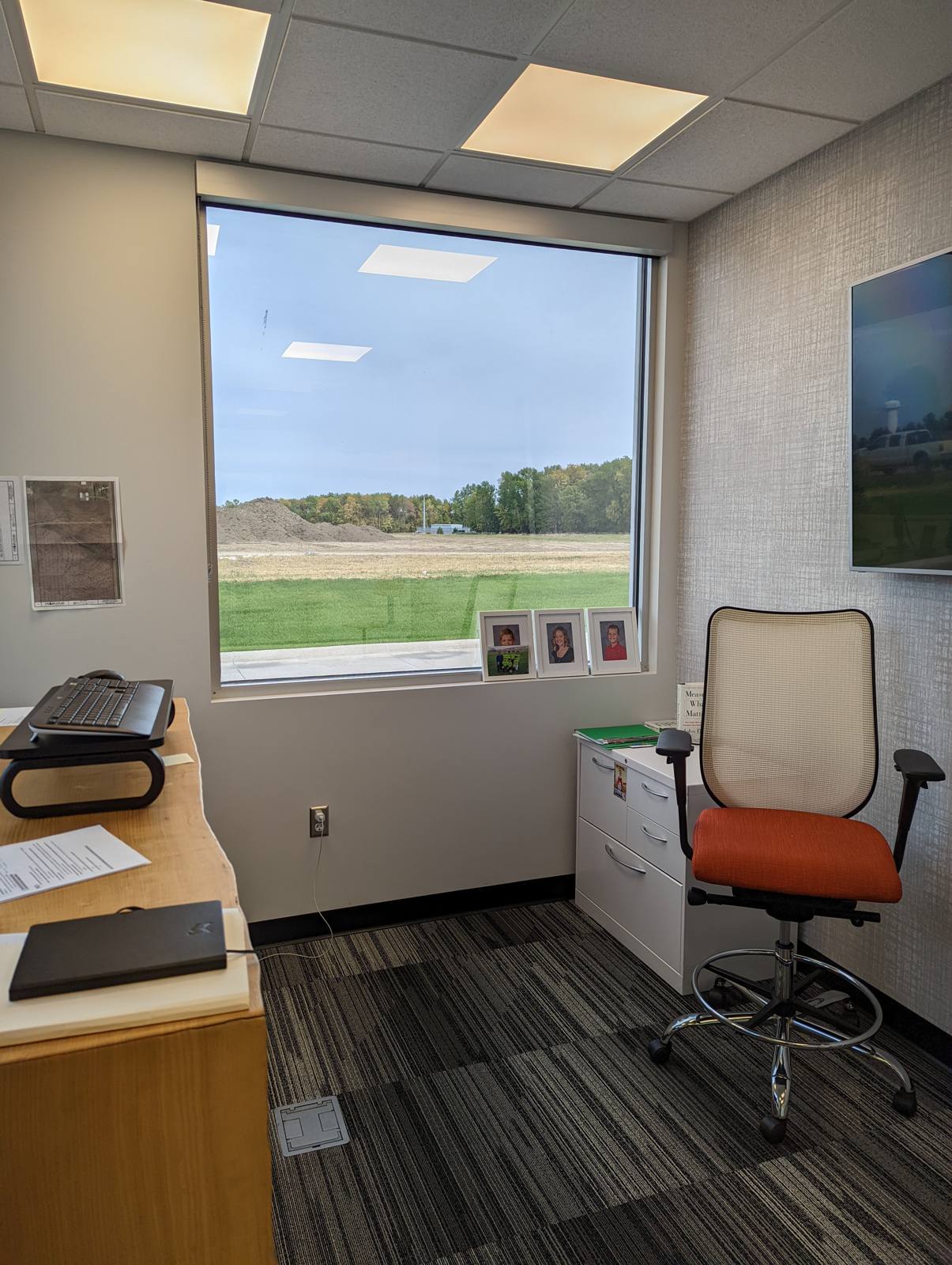 Office interior with a large window and window film installed in Dakota Dunes